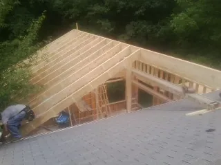 Framing a new roof addition that ties into an existing shingle roof in Torrey